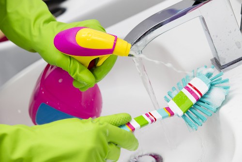 Detailed upholstery stain treatment during a cleaning visit
